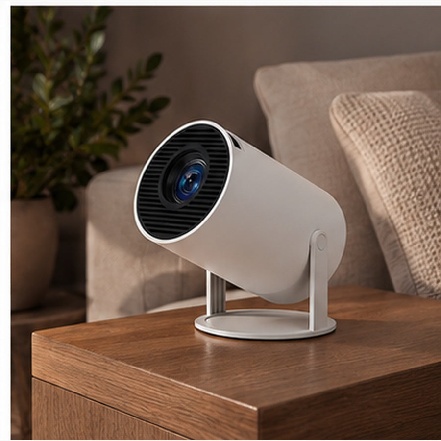 White portable projector on a wooden side table in a warm interior. — ULTAVEX &amp; CO